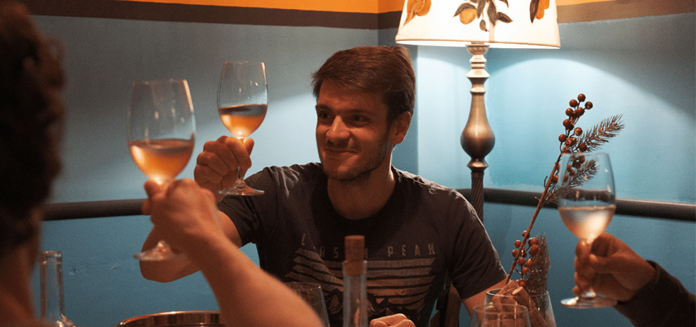 Group enjoying Azerbaijani wines at modern wine bars in downtown Baku.